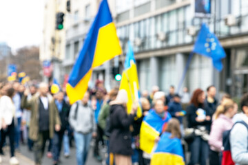 Wall Mural - Anti-war protest rally for Ukraine, crowd of people with Ukrainian flags