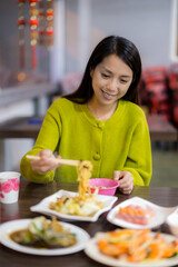 Sticker - Woman eat with noodles in local Taiwanese seafood restaurant