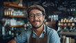 © Kulsawasd - Portrait of handsome male barista standing in cafe