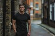 © AAA - professional male fitness model in black tshirt standing on the street