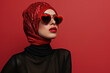 Studio portrait of a cool young Arabic woman posing wearing heart shaped love sunglasse