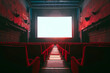 Cinema auditorium with red seats and white screen on the wall