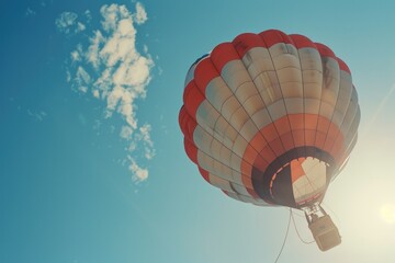 Canvas Print - A colorful hot air balloon soaring through the sky. Suitable for travel and adventure concepts.