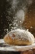 A loaf of bread sprinkled with powder. Suitable for food and baking concepts.