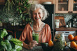 Happy elderly woman preparing a vegan smoothie. Senior woman making green smoothie.