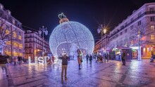 Panorama Showing Christmas Decorations With Big Ball On Luis De Camoes Square (Praca Luis De Camoes) Night Timelapse. One Of The Biggest Squares In Lisbon City In Portugal Illuminated In The Evening