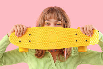 Sticker - Young woman with skateboard on pink background, closeup