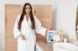 © Pixel-Shot - Beautiful young happy woman with small refrigerator for cosmetic products in bathroom