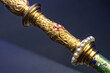 Royal scepter hilt with gold pearl details.
