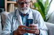 Senior Doctor Using Smartphone in Medical Practice, To convey the importance of technology in modern medical practice, and the role of smartphones in