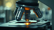© Margarita Ratatosk - Microscope with metal lens at laboratory. Scientific and healthcare research, examining of test sample in a lab. Medical equipment. Science and technology concept