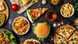 Top view of various fast foods on the table. Unhealthy fast food with sauces on wooden table. 