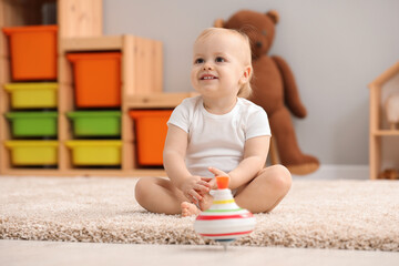 Sticker - Children toys. Cute little boy and spinning top on rug at home