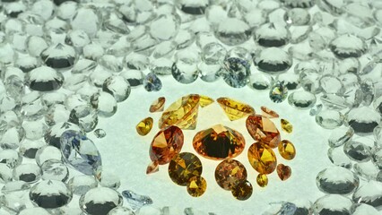 Wall Mural - .A group of yellow diamonds arranged in the middle of white diamonds in a white background..Top view of golden diamonds. white diamonds background video 4K..beautiful yellow diamonds turning around.