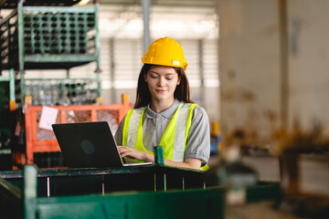 Wall Mural - woman engineer in uniform helmet inspection check control heavy machine robot arm construction installation in industrial factory. technician worker check for repair maintenance electronic operation