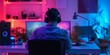 © AI Studio - A man facing the back of the camera sits at a computer and wears headphones on his head, neon lights in the room.