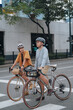 © Jonathan De Guzman - A young couple riding their bikes in the city.