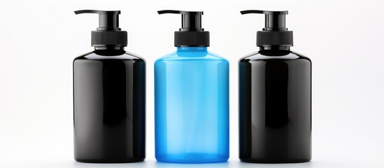 Wall Mural - Three violet bottles and a azure bottle on a white background. The plastic bottles contain liquid. The rectangular bottles are for cosmetics