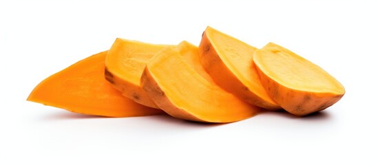 Sticker - A pile of sliced sweet potatoes, a nutritious plantbased ingredient, displayed on a white background. This natural food staple is commonly used in various cuisines to create delicious dishes