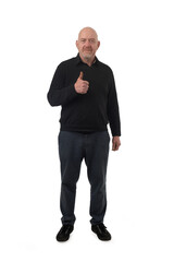 Wall Mural - Front view of a man showing thumbs up sign on white background.