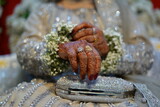 Fototapeta Dmuchawce - Indian bride hands with henna, silver purse