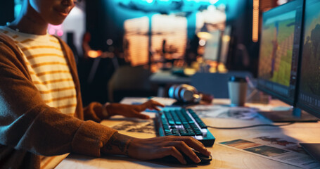 Fototapete - Portrait of Female Video Game Designer Working on a New 3D Level on Desktop Computer in Creative Office. Black Focused Woman Creating Metaverse and Adding Details to a Game Environment 
