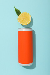 Sticker - Tin can and lemon on blue background, top view