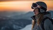 Female skier in helmet and goggles at sunny ski resort