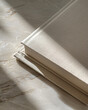 © Cadengo - aerial detail closeup photography of a blank closed book with a canvas cover, parisian haussmann closeup with an accent of wabi sabi style