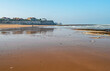 Joss Bay Kent on a bright March Afternoon and wet reflecting sands