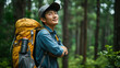 © wiparat - Young Asian traveling backpacker in forest