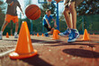 Players in Basketball Training Outdoors. Basketball Practice for Youth During Summer Camp