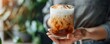 Embracing a chilled delight: Cold brew coffee with frothy foam. Concept Cold Brew Coffee, Frothy Foam, Chilled Delight, Coffee Lovers, Refreshing Beverage