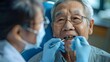 Asian Dentist Examining a Patients Teeth, To convey the importance of regular dental check-ups for maintaining good oral health