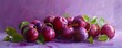 Succulent fresh plums gracefully arranged against a vivid purple background, highlighting their innate beauty.