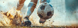 Fototapeta Sport - Foot in boots kicking a soccer ball. Professional football player kicking the ball