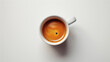 Cup of coffee on a white background, top view, copy space.