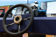 Ship control panel with steering wheel and VR headset on the desk