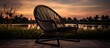 Wooden rattan chair bench isolated in a resort setting at twilight