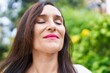 © Krakenimages.com - Young beautiful hispanic woman breathing with closed eyes at park