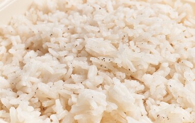 Wall Mural - Close-up image depicting steamed white rice seasoned with herbs, suitable for culinary and food-related content.