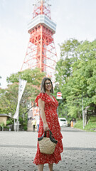 Wall Mural - Vibrant hispanic woman, beaming with joy, poses in glasses at tokyo's famous urban spot, spreading an infectious smile and a carefree, confident aura