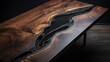 A beautiful wooden Designer brown table covered with black epoxy resin and varnish on a dark background of the room. Expensive handmade furniture. Hobbies, Business, Creativity concepts.
