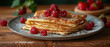 Folded pancakes with fresh raspberry on the plate on the wooden table. Horizontal banner 7:3.