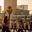 Diverse group practicing yoga outdoors at sunset with urban skyline backdrop