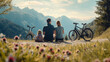 A family with a little child pausing for a break during their journey by bicycles. They are sitting and enjoying a picturesque view in the mountainside