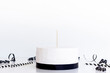 © Gravity Digital - Cake topper mock up . Styled with against a white background. Close up black birthday party ,White cake topper mockup. Cake with wooden stick for cake topper design presentation.
