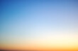 © Vera Aksionava - Blurred blue sky at sunset, graphient background