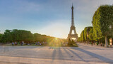 Fototapeta Na drzwi - Eiffel Tower seen from Champ de Mars at sunset timelapse, Paris, France