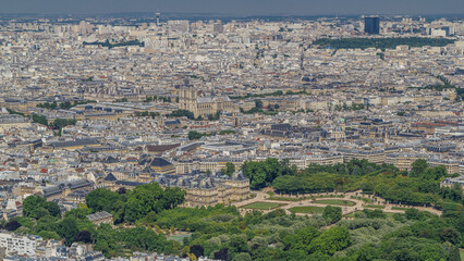 Wall Mural - Top view of Paris skyline from observation deck of Montparnasse tower timelapse. Main landmarks of european megapolis. Paris, France